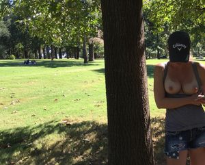 Flashing her tits in the park