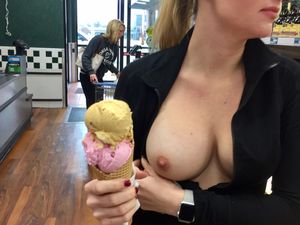 Naughty wife flashing her sexy breast in public