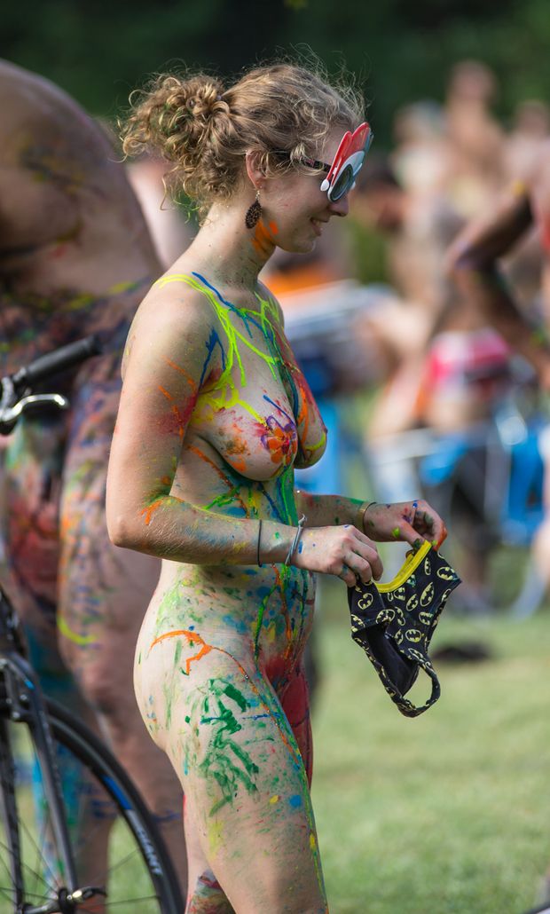 Body painted bike rider