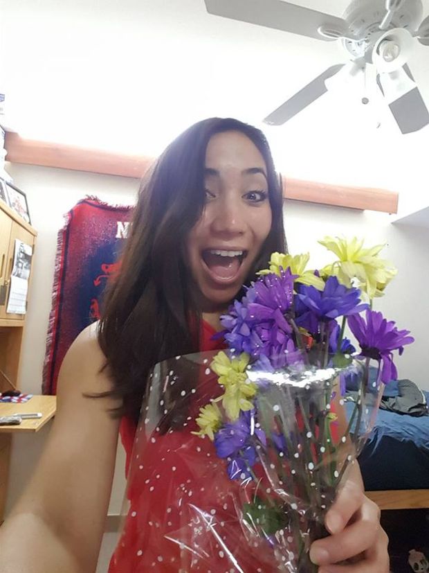 Alanna with flowers from her hubby.  Her hubby has no idea she was fucked bareback in her ass and mouth when living out her fantasy . . .