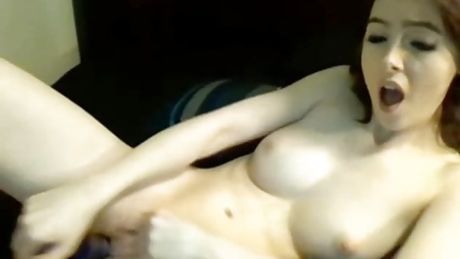 porcelain-skinned redhead hottie works her perfect pink hole with toy