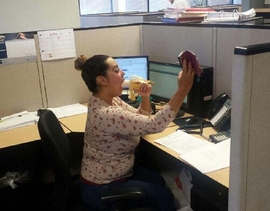 Taking a selfie of going down on a banana at work