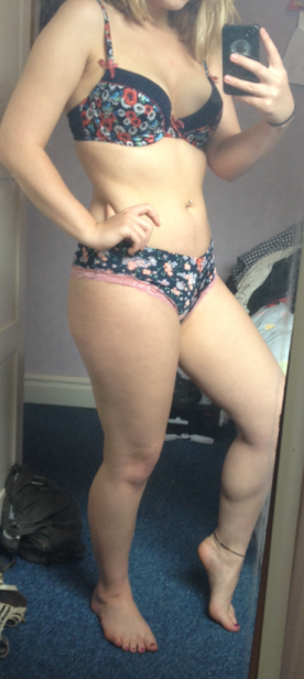 sexy blonde in lingerie in front of mirror