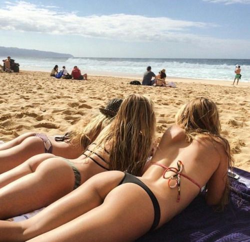 Three great butts on the beach