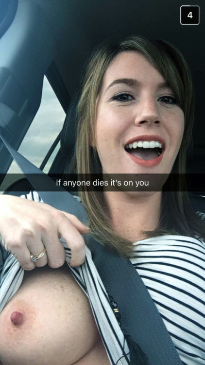 Amateur cutie showing off a tit in the car