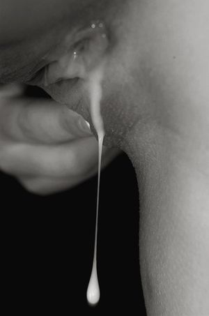 Cum dripping out of a pussy.