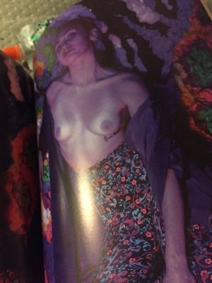 Miley Cyrus shows her boobs for a magazine photoshoot.