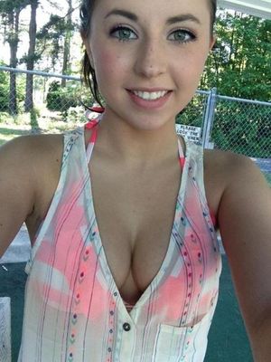 Amateur chick has a beautiful smile and a large neckline