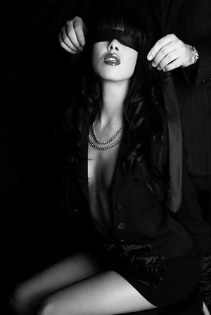 Sexy lady getting blindfolded.