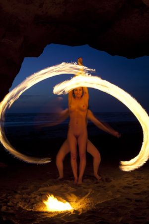 Fire dancing naked.