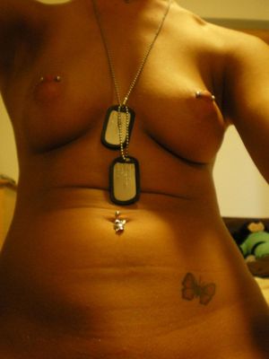 Sexy girlfriend shows off her perky tits and pierced nipples