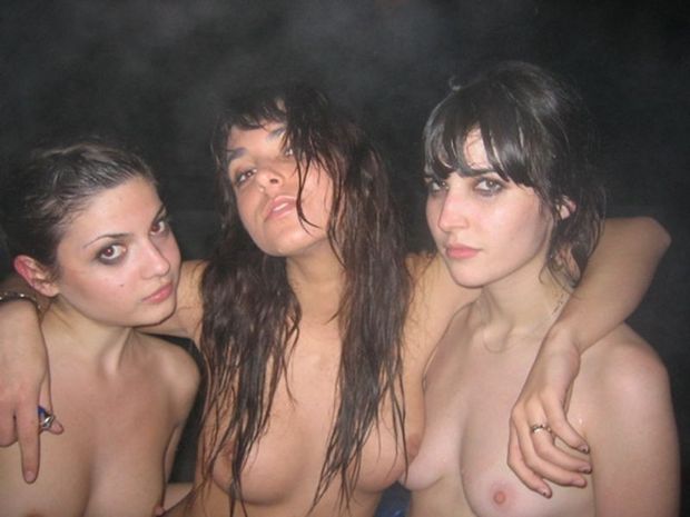 Three topless lesbian teens posing while smoking outdoors