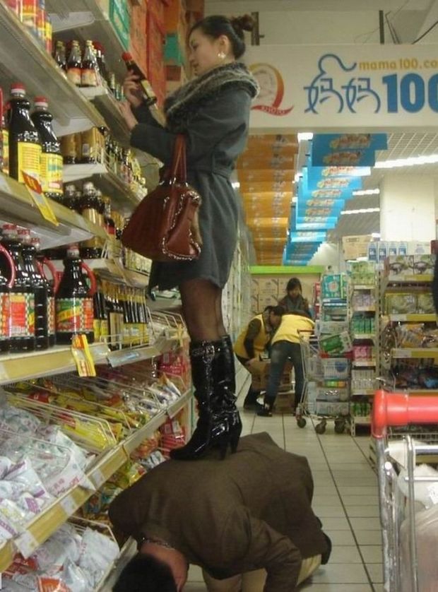 wife stand over husband to get stuff