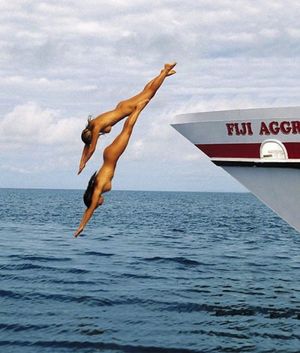 Diving from the yacht naked.