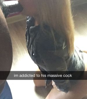 blonde with black jacket on her knees giving blowjob to bbc