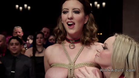 Female slaves submitted at crowded party