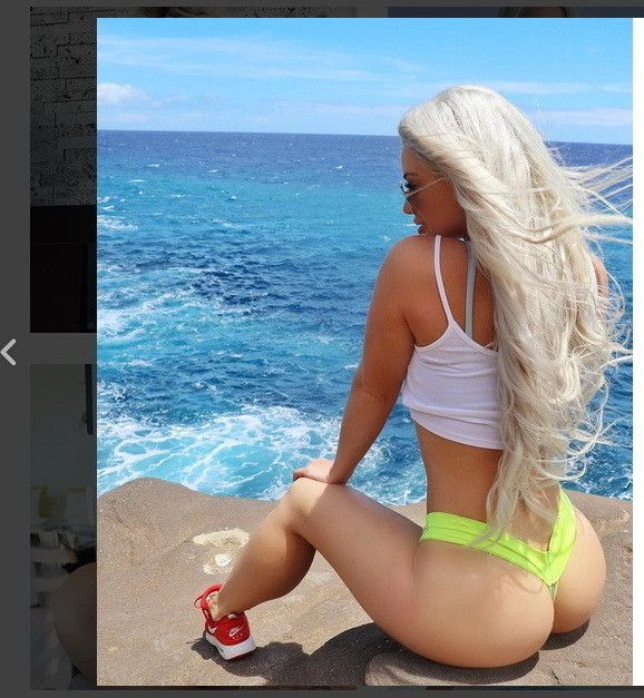 Voluptuous blonde with awesome ass in red tennis shoes.