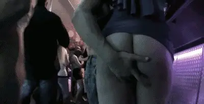 Fingering her pussy at a party.
