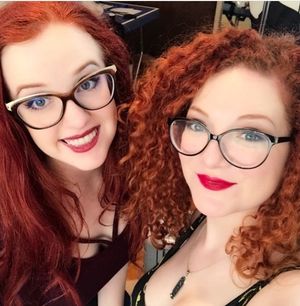 2 Redheads with glasses