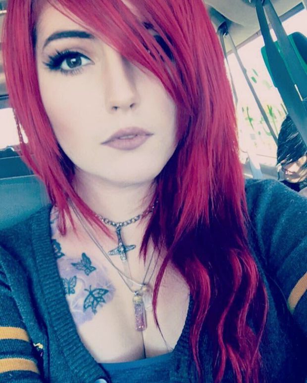 Leda Muir with red hair and cleavage