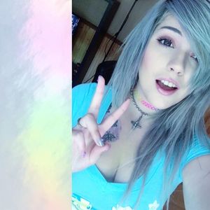 Leda Muir with grey hair and cleavage
