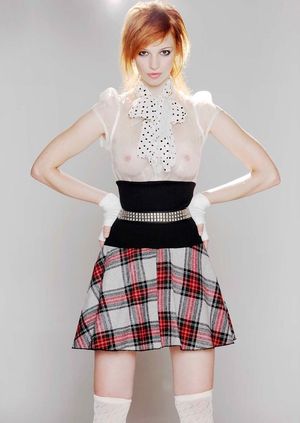 Plaid skirted redhead.....