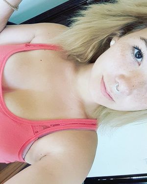 Cute blonde emo showing cleavage