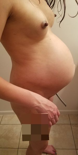 Wife's big pregnant belly