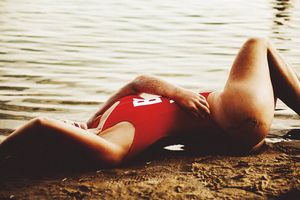 Woman lying in the sand.