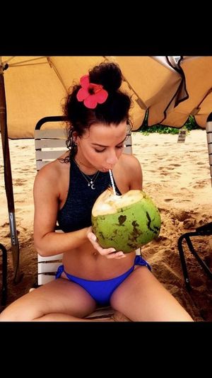Hottie sucking on a drink.
