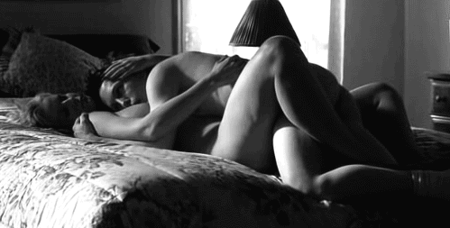 Couple cuddling on the bed