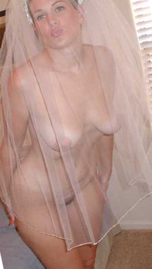 The bride naked with a see-through wedding dress.