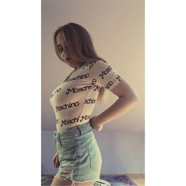 Blonde in tight shirt showing boobs