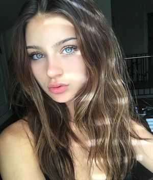 Bright Blue-Eyed Brunette with Plump Lips