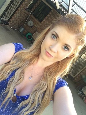 Blonde selfie in blue shirt