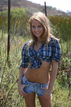 Cute blonde country gal in Daisy Dukes.