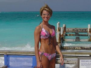 Athletic milf in a bikini outfit