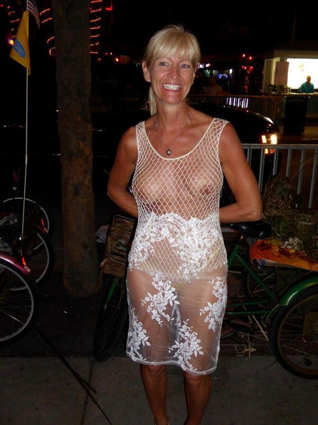 Adorable Milf dressed in a translucent dress