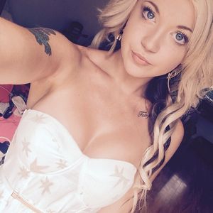 Blonde selfie in white corset