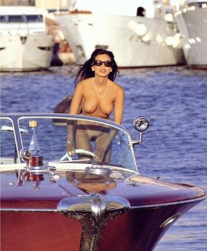 Another pretty lady driving the boat naked.