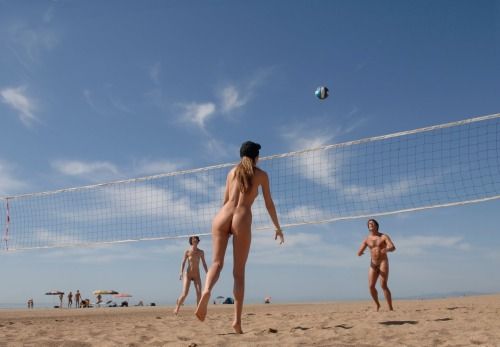 Naked beach volleyball game.