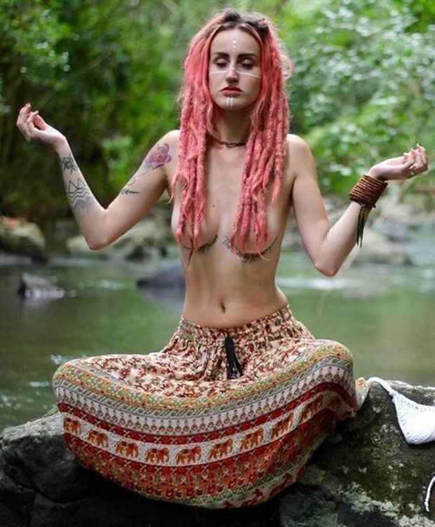 Chick meditating with her tits out