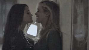 That Got Her Attention - Blonde and Brunette Kissing