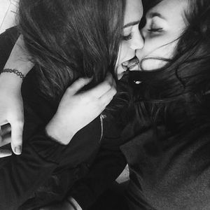 Two Brunettes Kissing