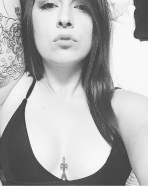 Sexy tattoo bitch showing cleavage