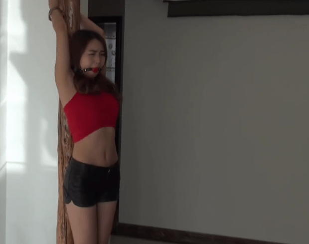 Beautiful Chinese Lady In High Heels Gagged And Chained To A Pole