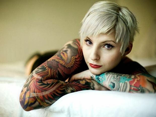 Platinum Blonde Pixie with Two Full Tattoo Sleeves