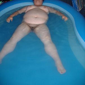 BBW relaxing in pool nude