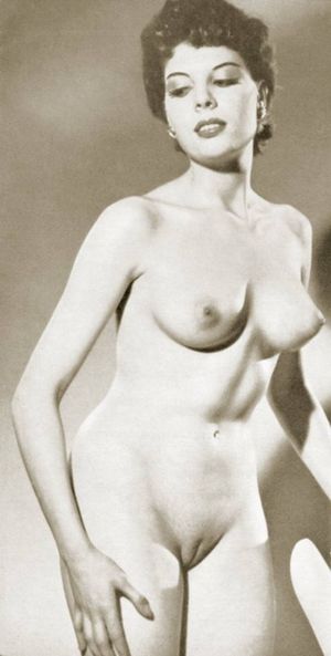 Beautiful brunette poses nude