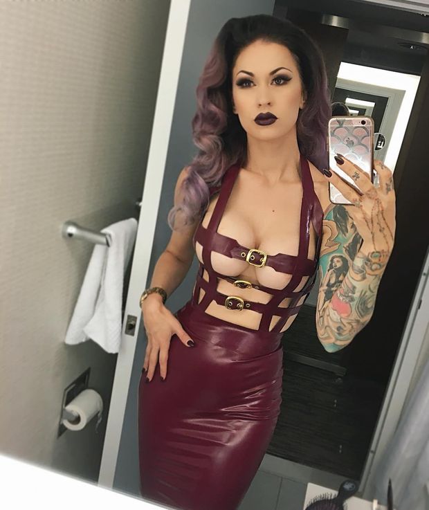 Inked LouLou D'vil wearing latex dress